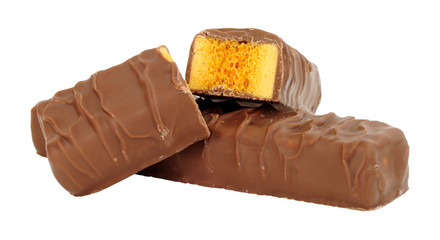 Chocolate covered honeycomb toffee bars isolated on a white background