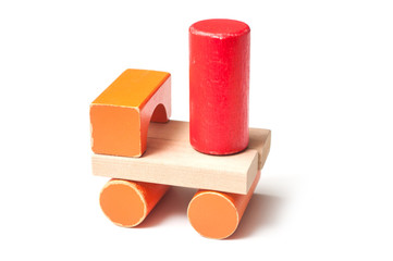 closeup of tractor on colorful wooden blocks on white background