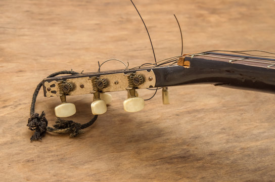 Broken guitar strings, guitar repair