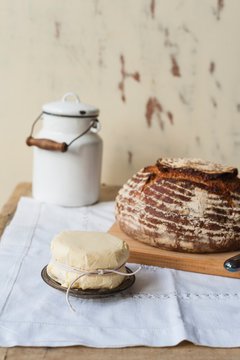 A loaf of bread and fresh butter