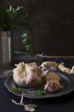 Dried garlic on a pewter plate