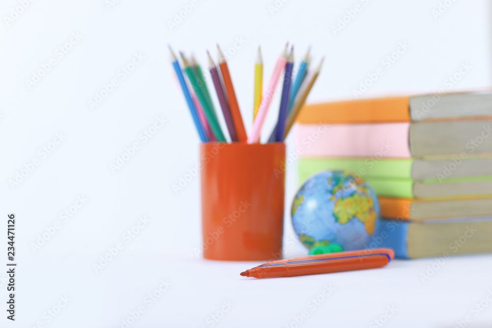 Wall mural globe, books and pencils on white background .photo with copy sp