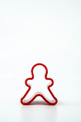 Cookie cutter gingerbread on white background.