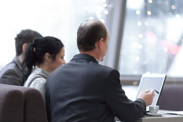 concept of business meetings.A team of employees uses a laptop for work