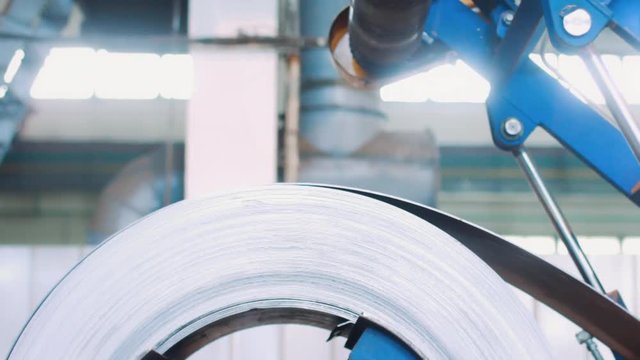 Cold rolled steel coil on decoiler mechanism in metal work manufacturing