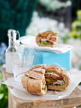 A stuffed loaf of bread for a picnic