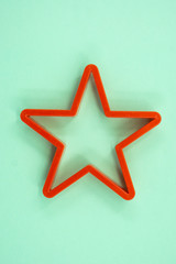 Cookie cutter star shape on green background