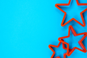 Cookie cutter star shape on blue background