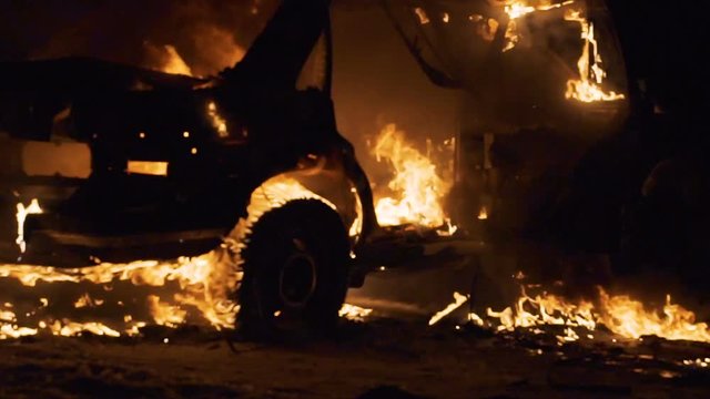 Blur backgroung burning car body, broken car on fire