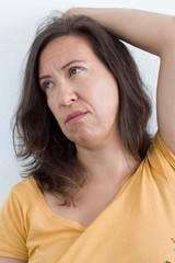 A woman with a worried gesture