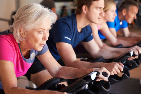 Close Up Of Group Taking Spin Class In Gym