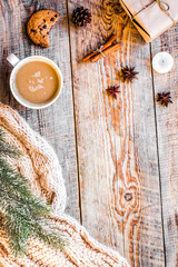 Christmas evening with cup of cocoa wooden background top view