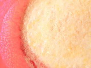 Salt granules on pink backgound