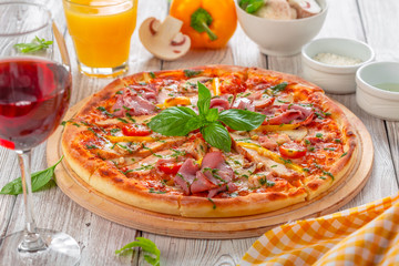 Delicious fresh pizza served on wooden table