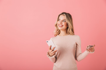 Portrait of a happy young woman wearing sweater