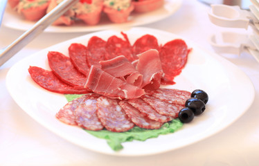closeup. catering table set service with silverware and glass stemware at restaurant before party