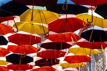 Fototapeta na wymiar Lot of colorful umbrellas in the street of old Québec 