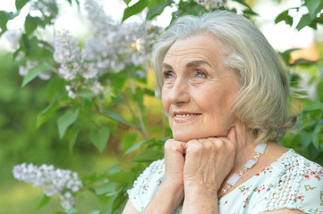 Portrait of happy smiling elderly woman posing