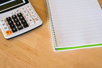 Calculator and pad to calculate business expenses