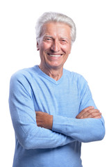 Smilling senior man posing on white background