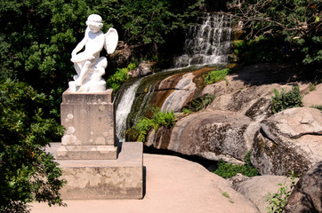 Sculpture, waterfall and stones