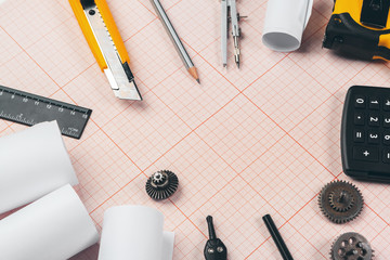 drawing tools on red graph paper with copy space