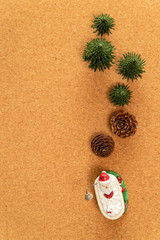 Fototapeta na wymiar Green Christmas tree with pine cone and Santa in bathtub 