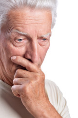 Thoughtful senior man posing on white background
