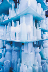 Glass objects on glass shelves