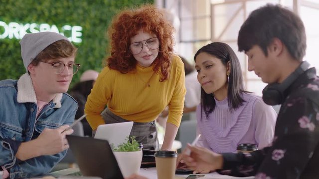young business people brainstorming creative team working together redhead project manager woman sharing ideas students discussing communication in diverse office using technology