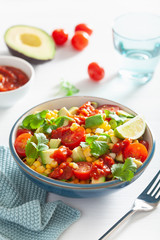 healthy vegan avocado sweetcorn tomato salad