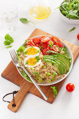 quinoa with boiled egg, avocado, tomato, arugula. healthy breakfast