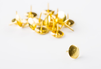 Closeup metal tacks on a white. Office concept