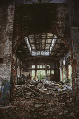 Abandoned industrial creepy warehouse inside old dark grunge factory building