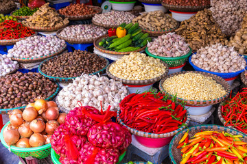 Fresh vegetables and fruits in traditional street market in Hanoi, Vietnam.