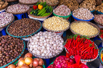Fresh vegetables and fruits in traditional street market in Hanoi, Vietnam.