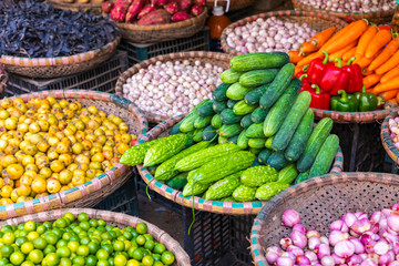Fresh vegetables and fruits in traditional street market in Hanoi, Vietnam.