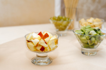 Chopped fruits in a glass bowl for a chocolate fountain