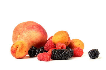 Peach, apricot, BlackBerry and raspberry isolated on white background