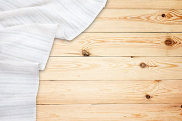 Old vintage wooden table with white tablecloth. Top view mockup.