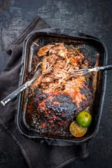  Traditional barbecue pulled pork piece of Bosten butt torn to bits as close-up in an old skillet © HLPhoto