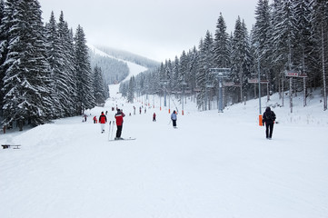 View of the ski slope and cable car on a winter day in the ski resort Jasna.
