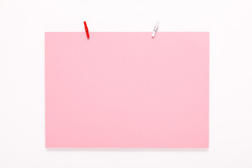 paper card on clothes peg on white background