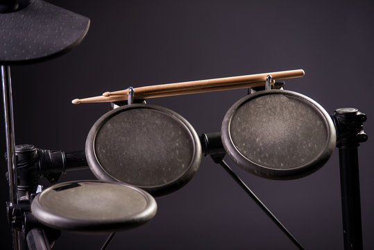 Drum sticks are on the electronic drum. Theme music.          