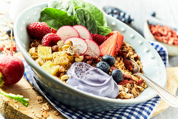 Bawl of muesli with berries in rustic style
