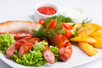 beautiful photo close-up menu of potatoes, sausage salad on a plate on a white background