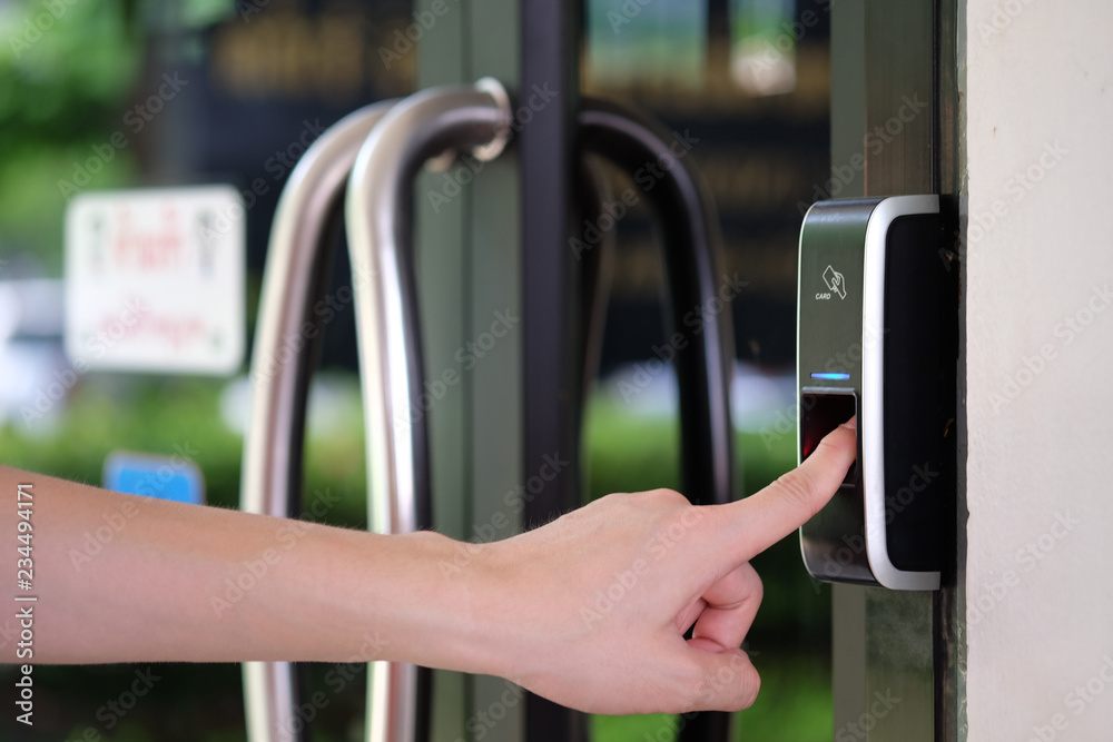 Aufkleber man paste finger to biometric fingerprint scanner. security, door access control, validation, cybers
