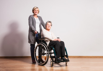 Studio portrait of a senior women in wheelchair.