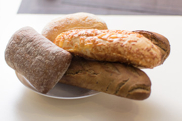 Assortment of baked bread on a plate.
