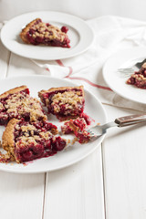 Homemade cherry pie on rustic background